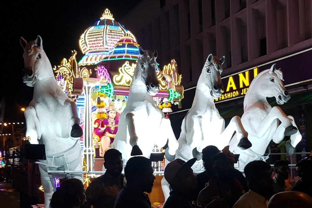 Thaipusam chariot pulled by four white horses during the festival procession in Malaysia